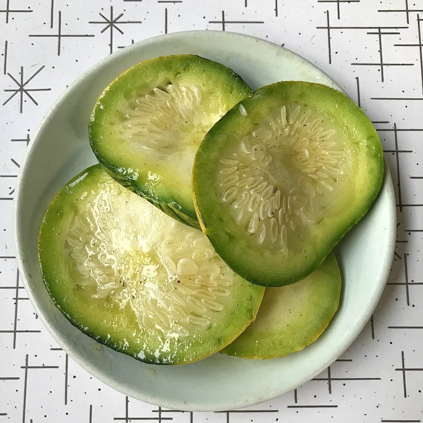 cooked slices of zapallo del tronco squash on a plate