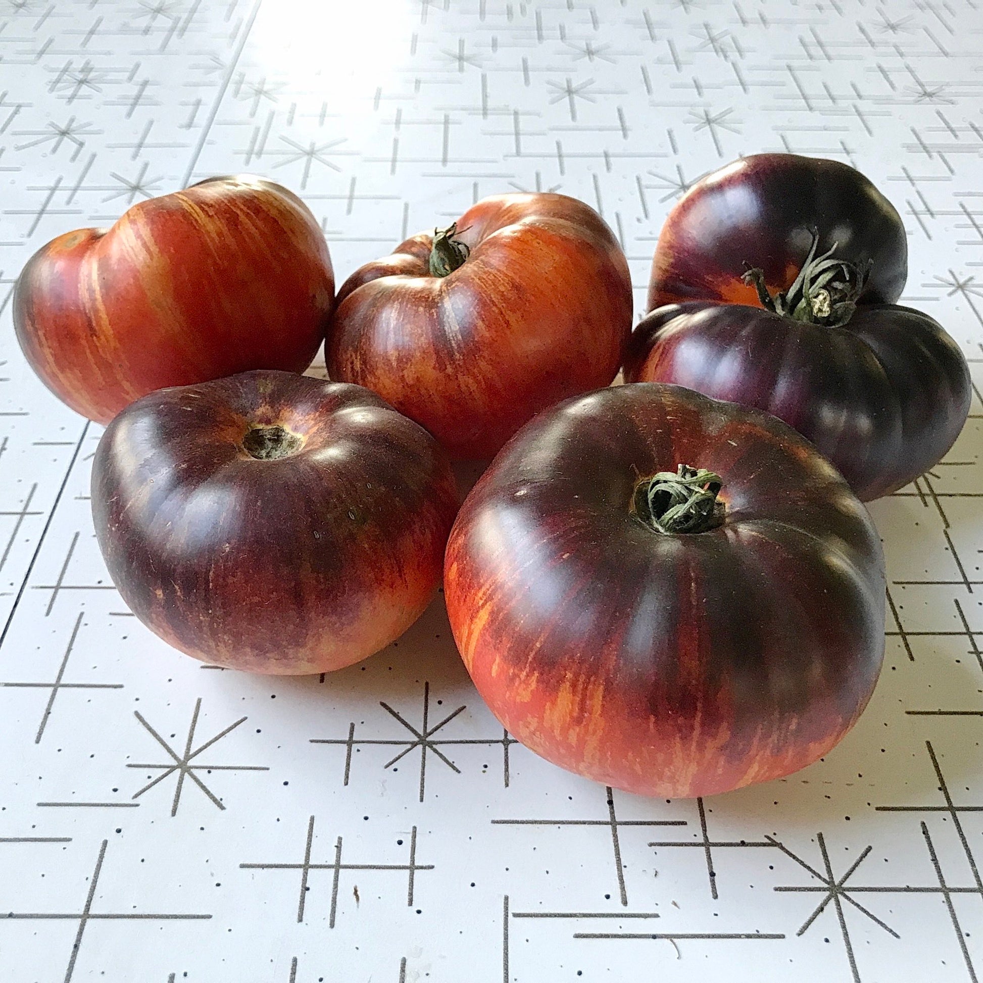 Six luscious antho-shouldered tomatoes.